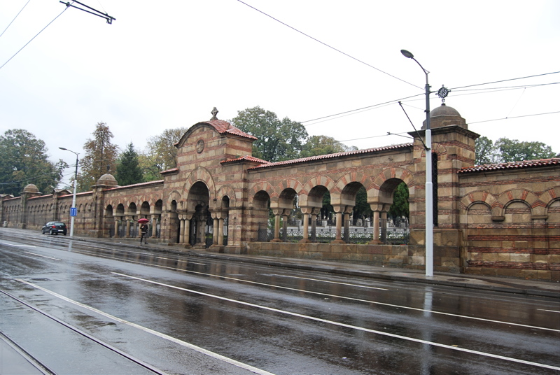 24 - The New Cemetery in Belgrade, specifically highlighting its monumental stone wall and arch entrance